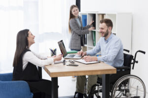 Co-workers embodying inclusivity of PWDs in the workplace